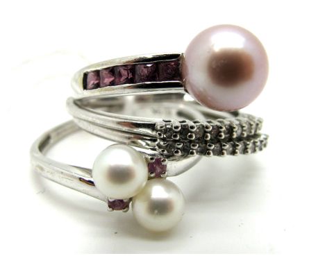 A 9ct White Gold QVC Dress Ring, with pearl highlight, between channel set shoulders; Together with Another Pearl Ring, of cr