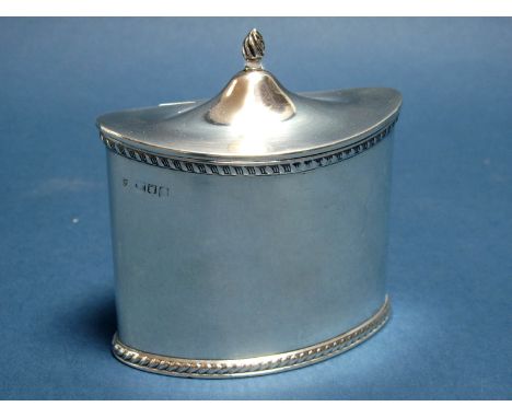 A Hallmarked Silver Caddy, (marks rubbed) of oval classical shape with gadrooned edge and hinged cover, base 9.9cm wide.