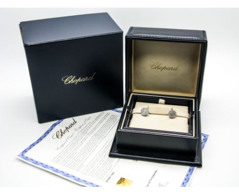 Chopard; A Pair of Modern 'Happy Diamonds' Diamond Set Earstuds, numbered "3162157" "833087", stamped "750", complete with Ch