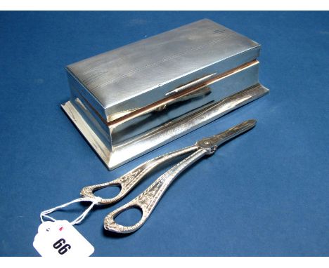 A Hallmarked Silver Cigarette Box, Walker &amp; Hall, Sheffield 1955, of rectangular form, the hinged lid engine turned, on s