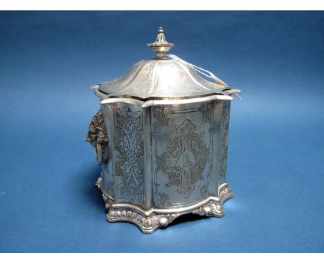 A XIX Century Plated Caddy, of Gothic style shaped design, with decorative panels, hinged lid and twin mask loop handles, cre