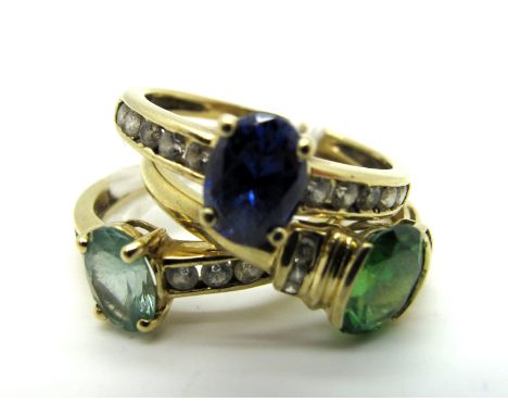 A 14ct Gold Stone Set Ring, oval claw set highlight, between channel set shoulders; Together with Another of Similar Design, 