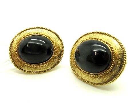 A Pair of Large Single Stone Vintage Gent's Cufflinks, each oval cabochon collet set within textured border, on swivel back b