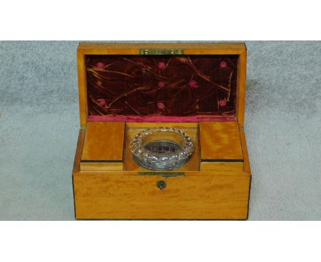 A 19th century satinwood with ebony lining tea caddy with two fitted lidded compartments and original cut class mixing bowl. 