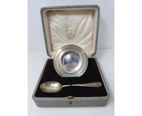 A sterling silver cased set of bowl and spoon. Engraved F.P.C., 1925.  Bowl hallmarked WH &amp;S Ltd for William Hutton &amp;