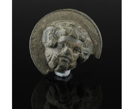 ITEM: Roundel with the head of Zeus AmmonMATERIAL: BronzeCULTURE: RomanPERIOD: 1st - 3rd Century A.DDIMENSIONS: 33 mm diamete