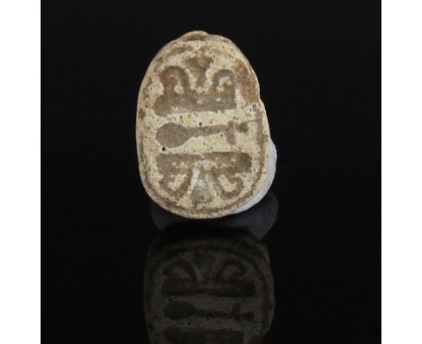 ITEM: Scarab with nefer-sign flanked by bent papyrus stalksMATERIAL: SteatiteCULTURE: EgyptianPERIOD: Second Intermediate Per