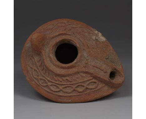 ITEM: Oil lampMATERIAL: PotteryCULTURE: ByzantinePERIOD: 6th - 7th Century A.DDIMENSIONS: 50 mm x 80 mm x 100 mmCONDITION: Go