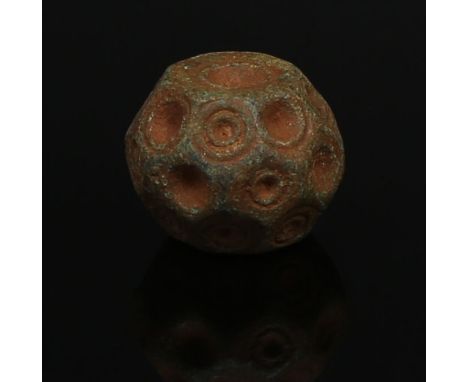ITEM: Polyhedron weightMATERIAL: BronzeCULTURE: ByzantinePERIOD: 10th - 13th Century A.DDIMENSIONS: 15 mm x 20 mmCONDITION: G