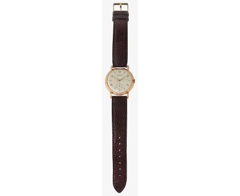 A gentleman's 18ct gold Moeris quartz wristwatchcircular silver dial with raised gold Arabic and triangular hour markers, sub