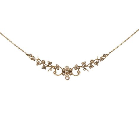 An Edwardian seed pearl necklacecentral flexible section consisting of scrolling floral and foliate design, set with seed pea