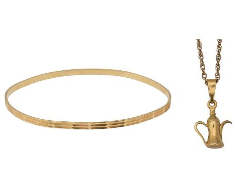 A bangle and a pendant on chaina chased bangle, stamped "750VI330"; a fancy link chain, stamped "9ct" and a teapot charm, sta