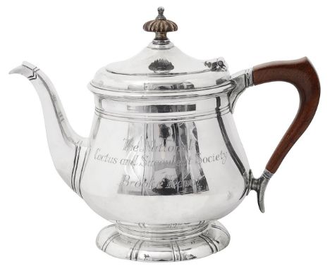 An Elizabeth II silver prize teapotLondon, 1969, Garrard &amp; Co Ltdof plain bellied form, with hinged domed cover, wooden h