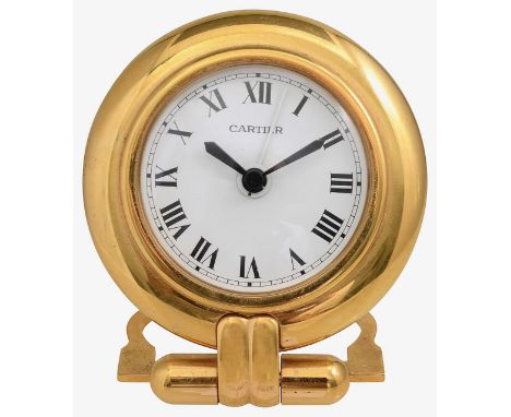 Must de Cartier. A gilt brass Colisse travel alarm clockcircular white dial with black Roman numerals, minute track, black ha