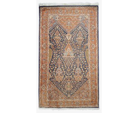 A Persian Kashan silk mix prayer ruglate 20th centurythe central blue ground mihrab containing flower vase within brown flora