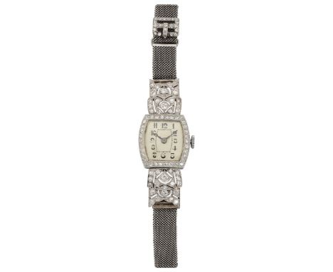 An Art Deco diamond set lady's cocktail watch lozenge dial with black Arabic numerals, manual wind movement, the case set wit