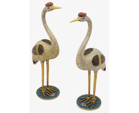 A pair of Chinese cloisonnŽ enamel cranes late 18th / 19th centuryeach with slender necks curved in a 'S' shape, the heads wi