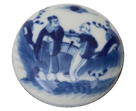 A Chinese blue and white porcelain seal paste box and cover19th centuryof compressed circular from, decorated with a scholar 