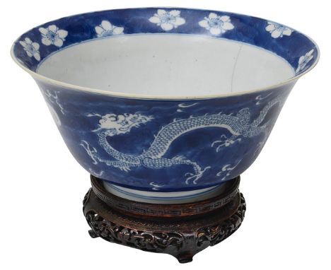 A 19th century Chinese blue and white dragon bowlof tapering form with everted rim, the exterior decorated with two dragons c