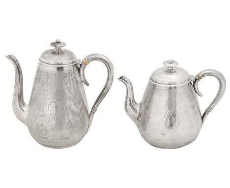 A Victorian silver tea pot and coffee potboth Birmingham, 1862 and 1867, Gough & Silvesterof tapering bellied form with plain