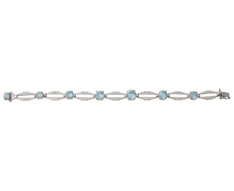 An Art Deco zircon bracelet seven round brilliant-cut zircons, of graduating size, with alternating geometric panels, stamped