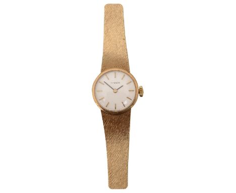 A 9ct gold lady's Tissot bracelet wristwatchthe silvered circular dial with baton numerals, manual wind, textured strap with 