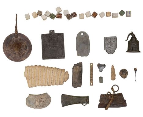 A collection of antiquities and curios to include a Bronze Age cast bronze socket socket axe head with a small loop, accompan