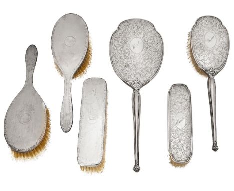 Two three piece silver backed dressing table setsfirst Birmingham, 1964, Charles S Green &amp; Co Ltd, comprising hand mirror