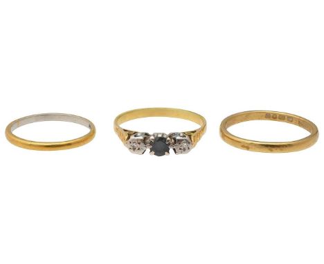 Three rings22ct gold band, stamped with hallmarks; 22ct gold and platinum band, stamped "22ct PLATINUM" and sapphire and diam