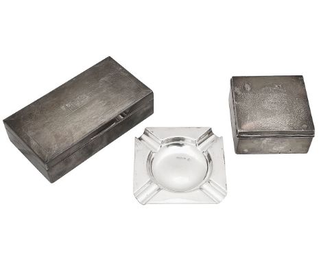 Two silver prize table cigarette boxes and an ashtrayfirst Birmingham, 1949, makers mark rubbed, rectangular with engine turn