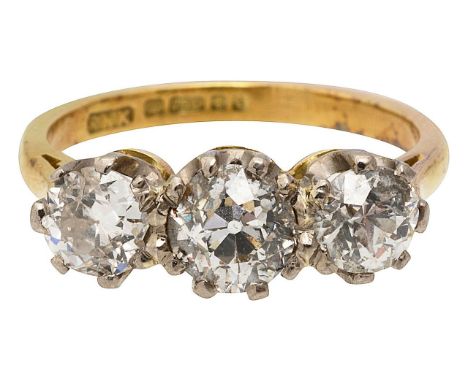A diamond three stone diamond ring three round brilliant cut diamonds, of slightly graduating size, claw set to a tapering 18