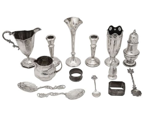 A collection of silver various dates makers markscomprising an American panelled helmet from pedestal cream jug stamped Sterl