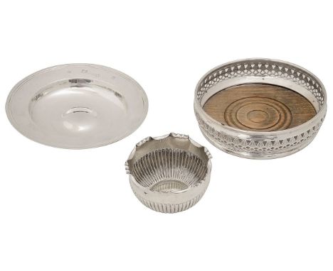 An Elizabeth II silver armada dish, a bottle coaster and a late Victorian sugar basinfirst London, 1963, William Comyns &amp;