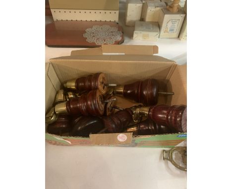 A QUANTITY OF WOODEN SOFA LEGS WITH BRASS CASTORS 