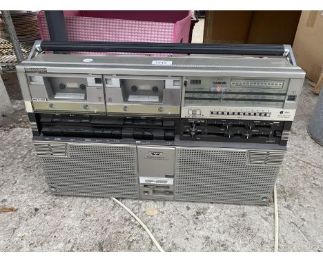 A VINTAGE SHARP STEREO RADIO AND DOUBLE CASSETTE 