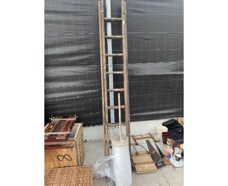 A TWO SECTION 18 RUNG WOODEN LADDER AND A ROLL OF POLYTHENE 