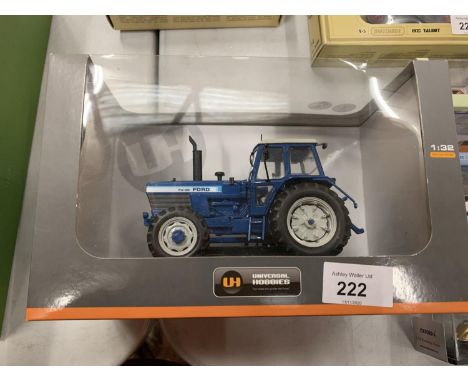 A BOXED UNIVERSAL HOBBIES DIE CAST FORD TRACTOR 1:32 
