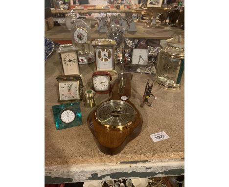 AN ASSORTMENT OF CLOCKS TO INCLUDE A BAROMETER AND THREE CARRIAGE CLOCKS ETC 