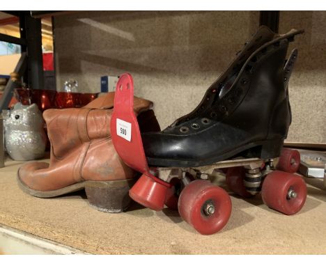 A VINTAGE PAIR OF ROLLER SKATES AND A VINTAGE PAIR OF COWBOY BOOTS SIZE 7 