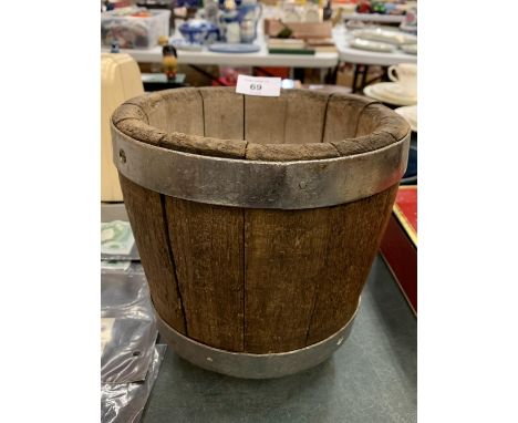 A VINTAGE WOODEN AND METAL CHEESE MOULD 