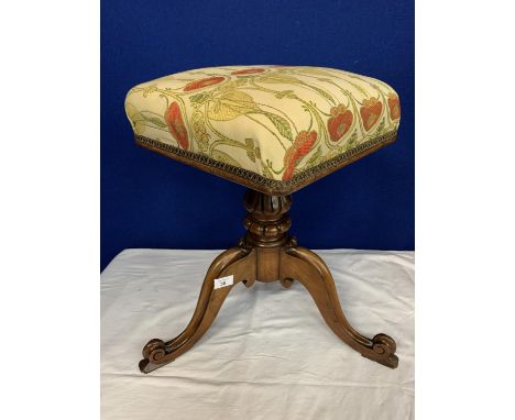 A WOODEN ROTATING PIANO STOOL UPHOLSTERED IN ART NOUVEAU STYLE 