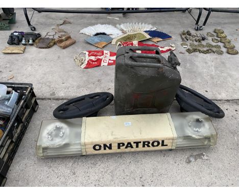 AN ON PATROL ROOF LIGHT, A JERRY CAN AND TWO STEERING WHEELS 