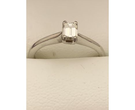 A PLATINUM EMERALD CUT DIAMOND SOLITAIRE RING 0.43 CARAT CLARITY: VS1 COLOUR: K SIZE: O 