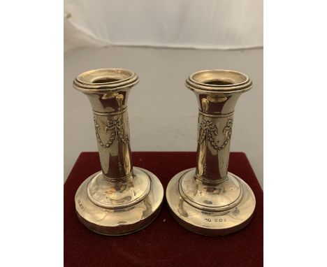 A PAIR OF VINTAGE SILVER CANDLESTICKS 