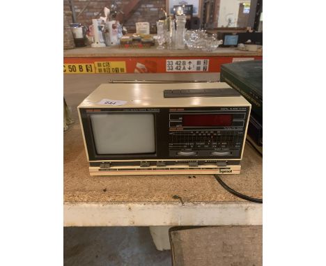 A RETRO INGERSOLL DIGITAL RADIO ALARM CLOCK INCORPORATING A 4.5 INCH BLACK AND WHITE TELEVISION 