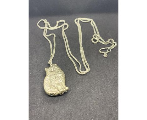 A VINTAGE WHITE METAL CAT RATTLE ON A CHAIN 
