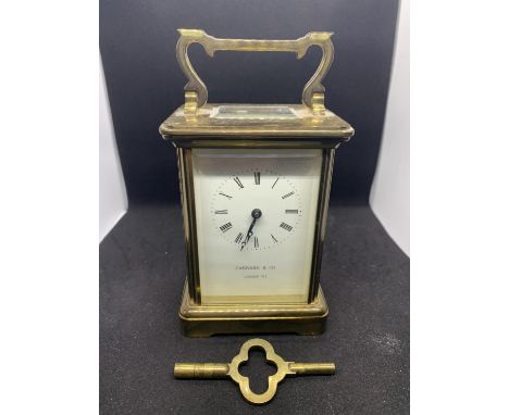A GARRARD &amp; CO LONDON BRASS CARRIAGE CLOCK WITH SWISS MOVEMENT IN WORKING ORDER WITH KEY 