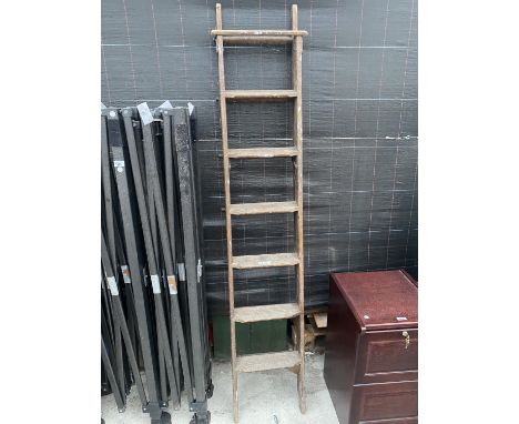 A SET OF VINTAGE WOODEN STEPLADDERS 