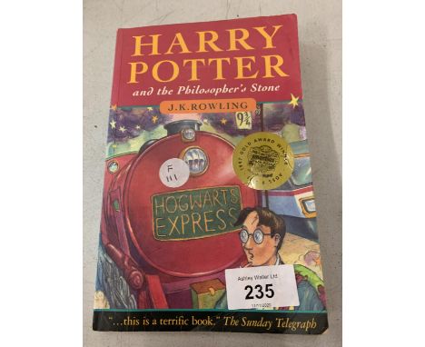 A FIRST EDITION PAPERBACK COPY OF 'HARRY POTTER AND THE PHILOSOPHER'S STONE' 