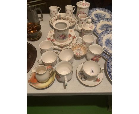 A LARGE ASSORTMENT OF CERAMIC WARE TO INCLUDE CUPS AND SAUCERS ETC 